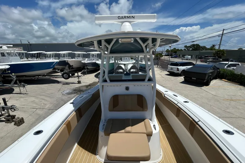 Slide: The Image of 2025 Cape Horn 34 XS boat with Garmin equipment, docked under a clear sky. - 23