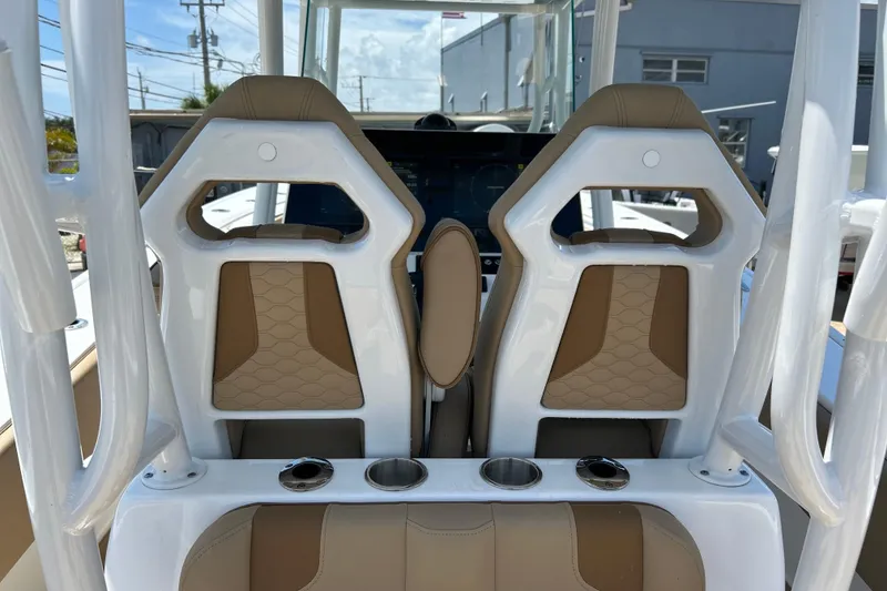 Slide: The Image of Interior view of 2025 Cape Horn 34 XS boat seats with cup holders. - 24