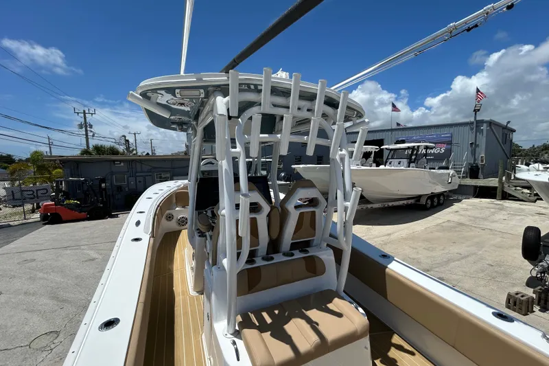 Slide: The Image of 2025 Cape Horn 34 XS boat with sleek design, docked under clear blue skies. - 25
