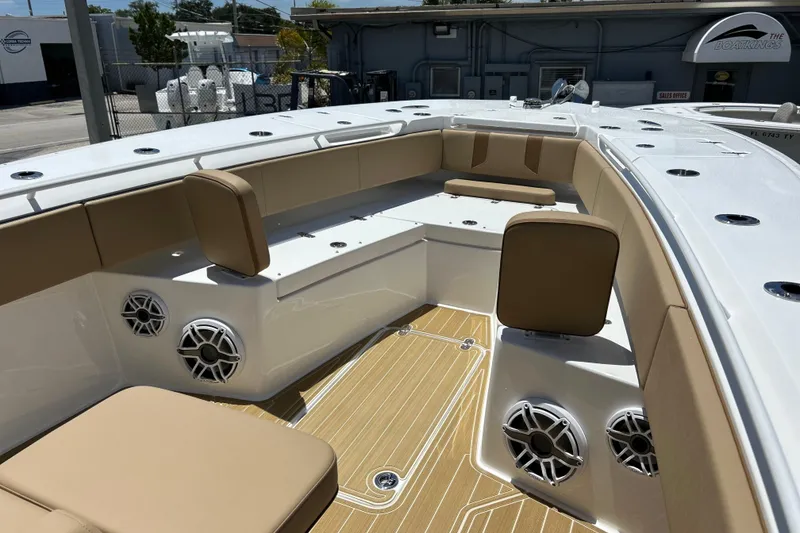 Slide: The Image of 2025 Cape Horn 34 XS boat interior with tan seating and modern speakers. - 28