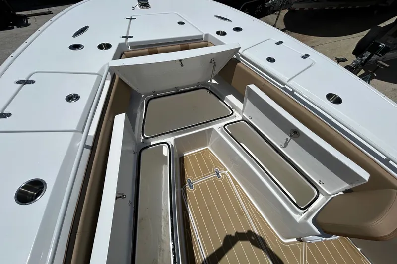 Slide: The Image of 2025 Cape Horn 34 XS boat deck with open storage compartments. - 29