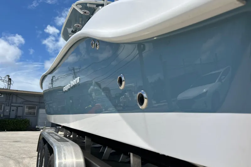 Slide: The Image of 2025 Cape Horn 34 XS boat on trailer under blue sky. - 3