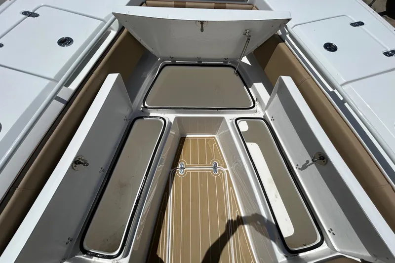 Slide: The Image of 2025 Cape Horn 34 XS boat interior storage compartments open, showcasing spacious design. - 30