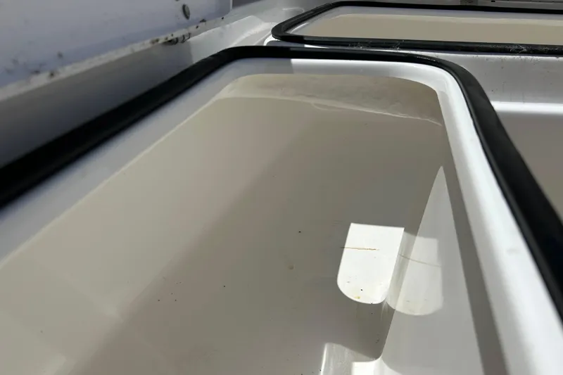 Slide: The Image of Storage compartment of 2025 Cape Horn 34 XS boat, featuring sleek white interior design. - 31