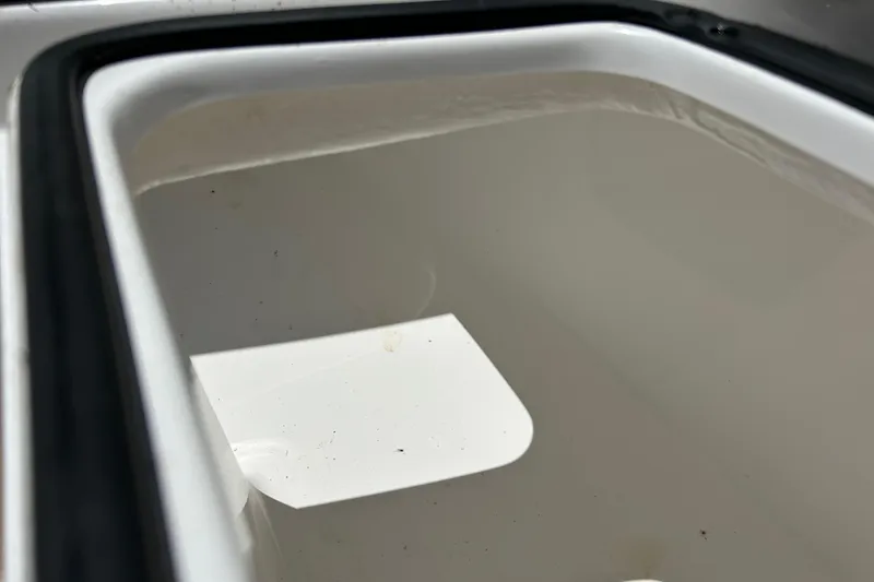 Slide: The Image of Storage compartment of 2025 Cape Horn 34 XS boat, featuring a clean, white interior. - 32