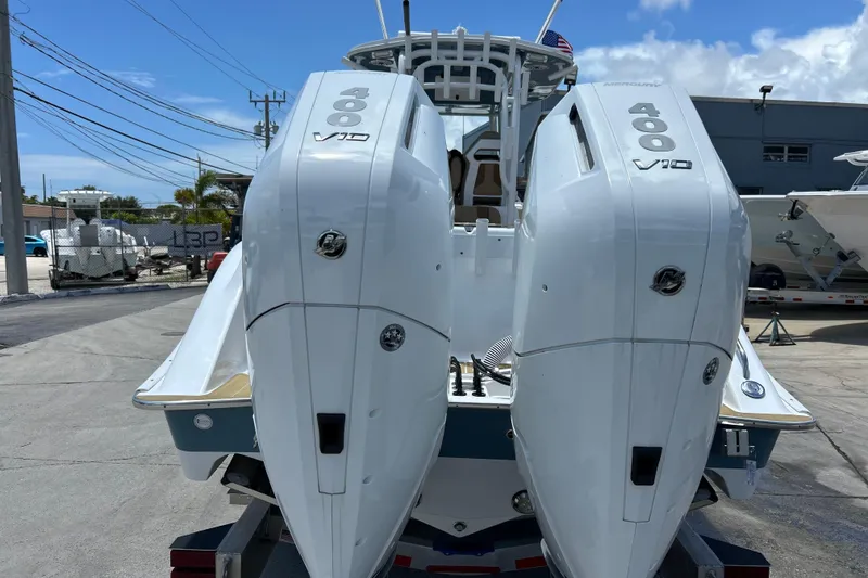 Slide: The Image of 2025 Cape Horn 34 XS boat with dual 400 V10 engines, parked outdoors. - 36