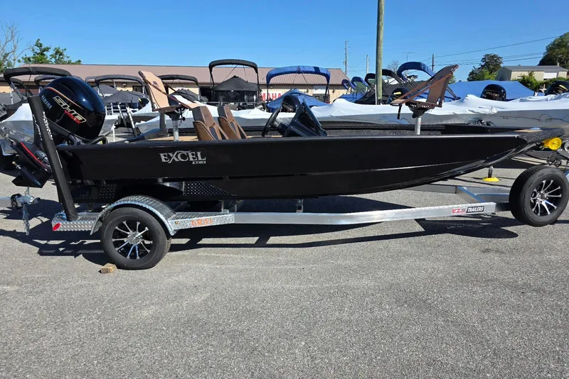 The Image of 2026 Excel EX 183 boat on trailer, black exterior, parked outdoors. - 1