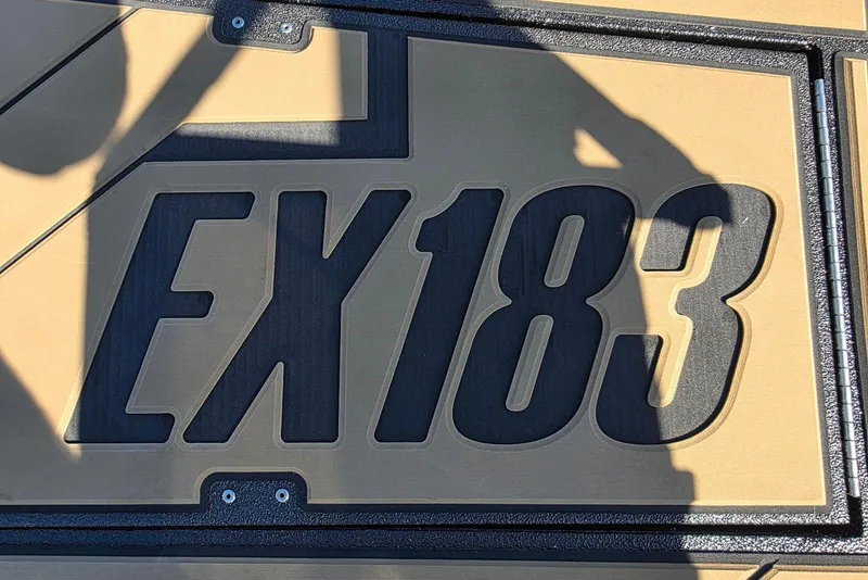 Slide: The Image of Close-up of Excel EX 183 logo on a textured surface, 2026 model. - 12
