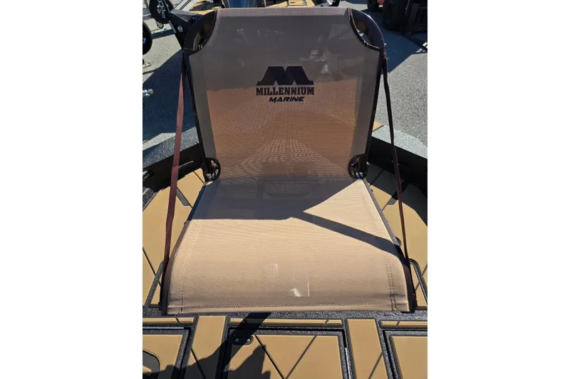 Slide: The Image of Millennium Marine seat on Excel EX 183 boat, 2026 model, in outdoor setting. - 13