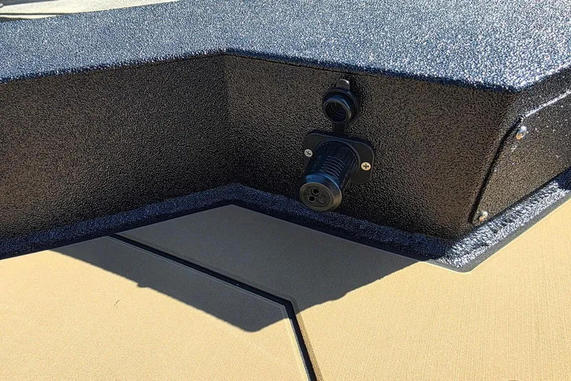 Slide: The Image of Close-up of Excel EX 183 (2026) boat's textured surface and electrical connector. - 16