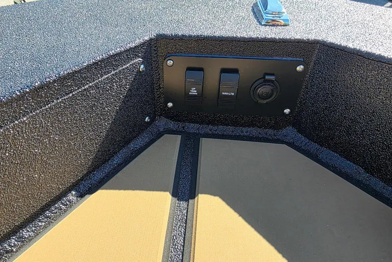 Slide: The Image of Control panel on Excel EX 183 boat, featuring switches and a 12V outlet. - 17