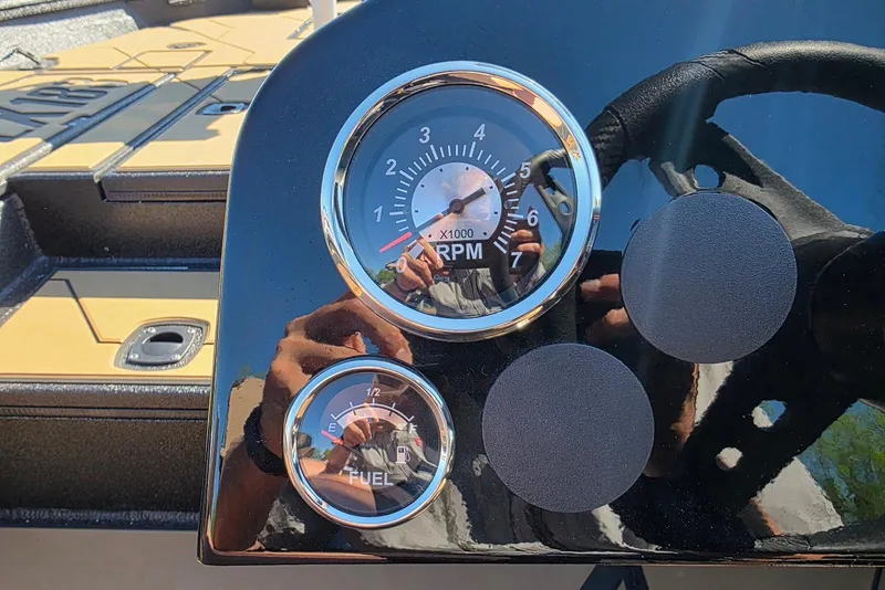 Slide: The Image of Dashboard of Excel EX 183 boat, featuring RPM and fuel gauges, 2026 model. - 22