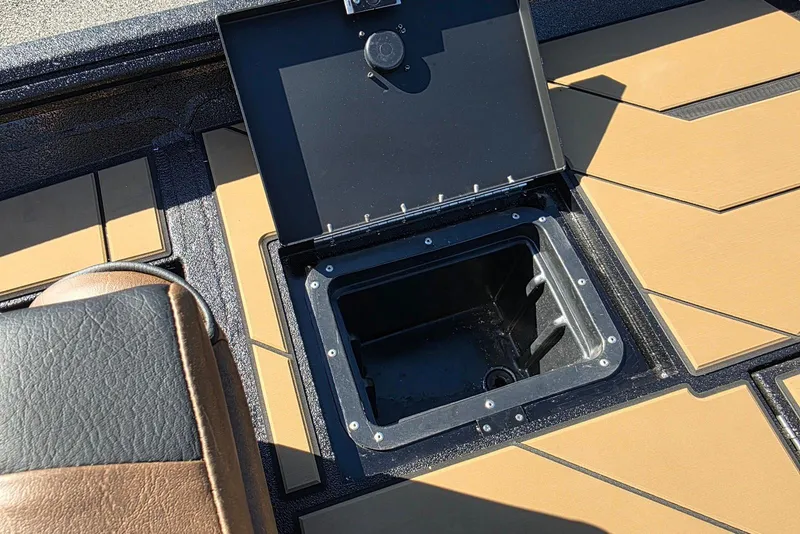 Slide: The Image of Open storage compartment on 2026 Excel EX 183 boat deck. - 28