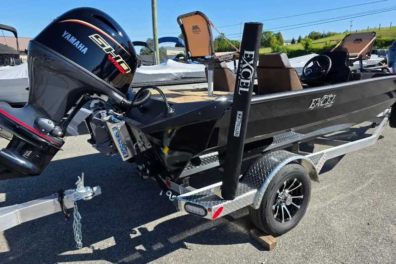 Slide: The Image of 2026 Excel EX 183 boat with Yamaha engine on a trailer, parked outdoors. - 3