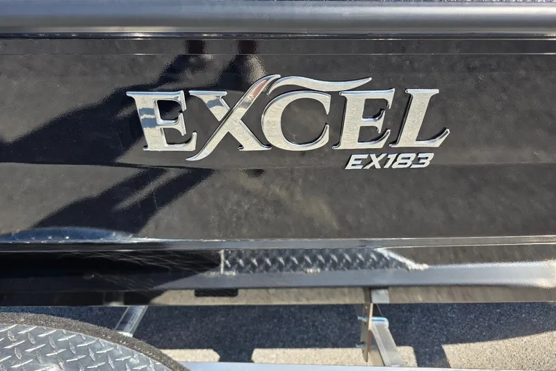 Slide: The Image of Excel EX 183 logo on black surface, 2026 model. - 4