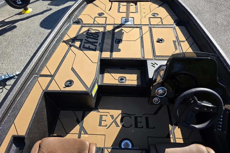 Slide: The Image of Excel EX 183 boat interior, 2026 model, featuring tan and black design with steering console. - 7