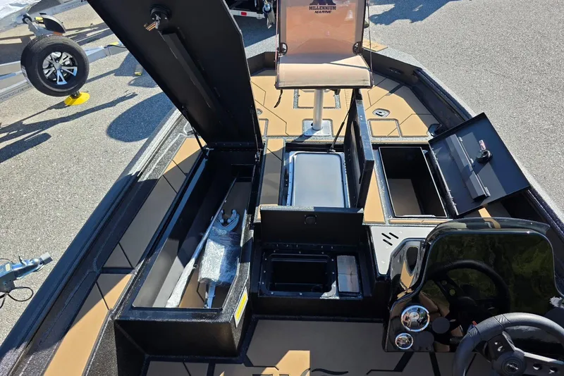 Slide: The Image of Interior view of 2026 Excel EX 183 boat showcasing storage compartments and seating. - 8