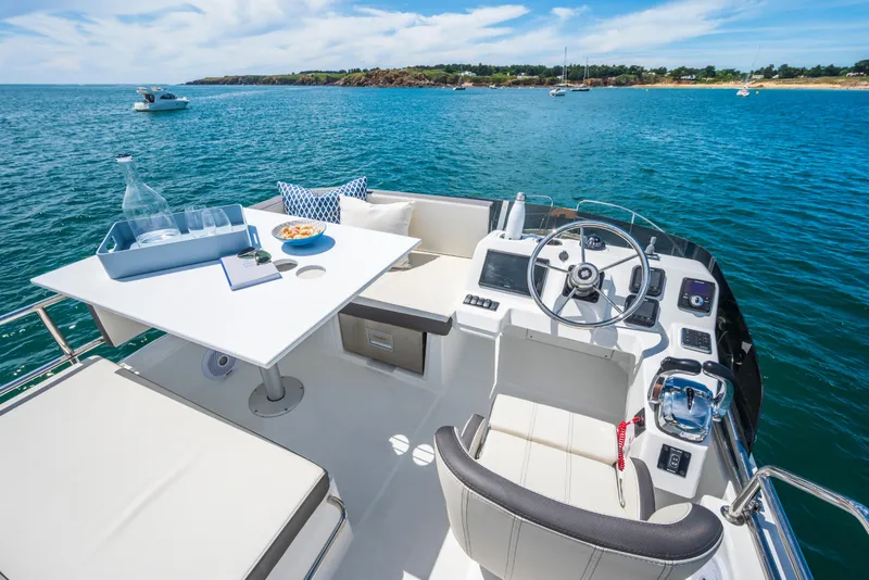 Slide: The Image of 2025 Beneteau Antares 11 Fly yacht with elegant flybridge and ocean view. - 33