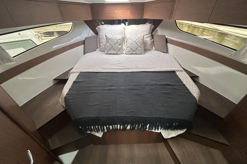 Slide: The Image of Luxurious cabin interior of 2025 Beneteau Antares 11 Fly with cozy bedding. - 4