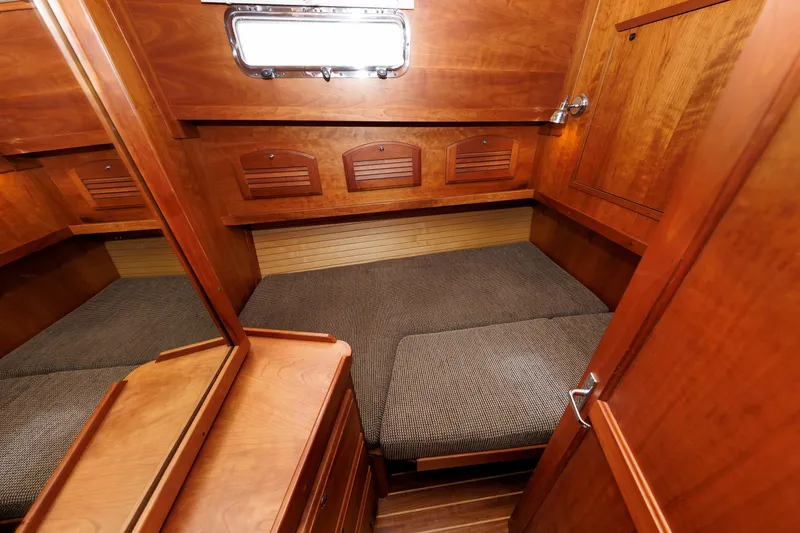 Slide: The Image of Cozy cabin interior of 2004 Sabre 42 Express yacht with wooden finish. - 11