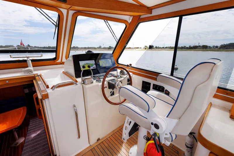 Slide: The Image of Interior helm of 2004 Sabre 42 Express yacht with navigation equipment and captain's chair. - 15