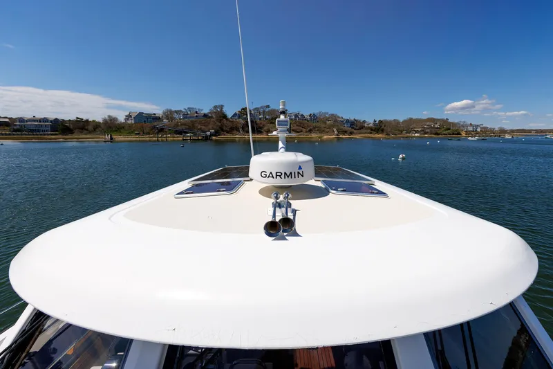 Slide: The Image of 2004 Sabre 42 Express yacht with Garmin equipment on calm waters. - 25