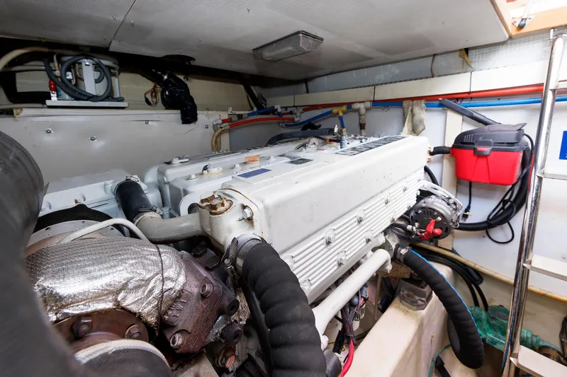 Slide: The Image of Engine room of a 2004 Sabre 42 Express boat, showcasing mechanical components. - 26