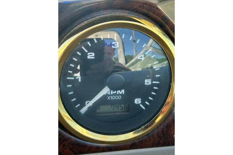 Slide: The Image of Close-up of RPM gauge on 2001 Rinker 310 Express Cruiser boat. - 21