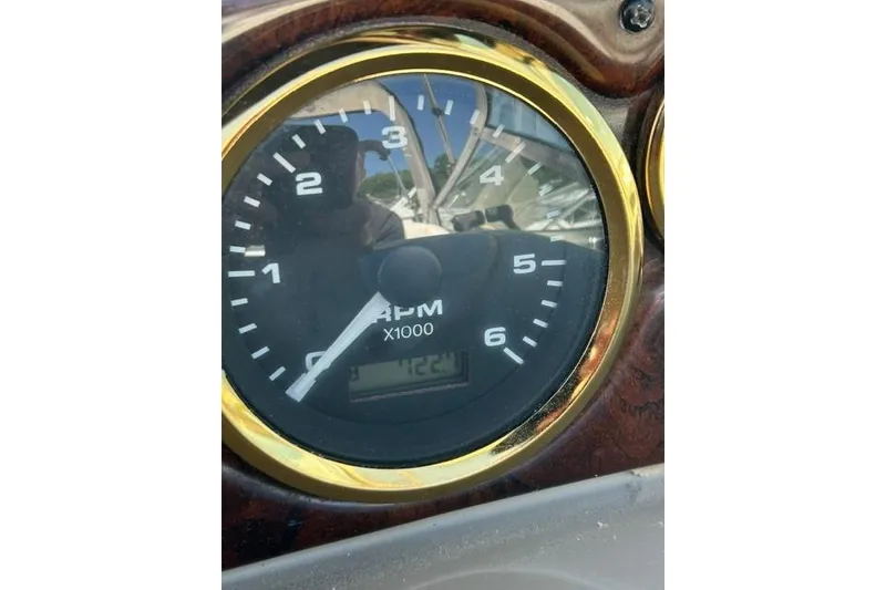 Slide: The Image of Close-up of RPM gauge on 2001 Rinker 310 Express Cruiser boat dashboard. - 22