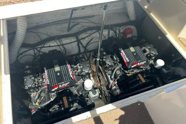 Slide: The Image of Engine compartment of a 2001 Rinker 310 Express Cruiser with twin MerCruiser 5.0L engines. - 23