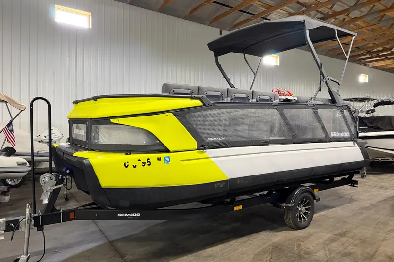 The Image of 2022 Sea-Doo Switch Cruise 21 pontoon boat in a storage facility. - 1