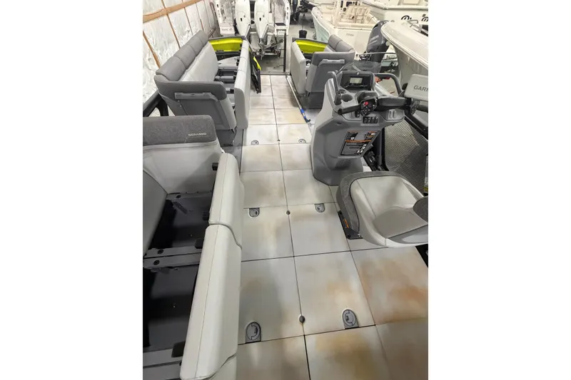 Slide: The Image of 2022 Sea-Doo Switch Cruise 21 interior with spacious seating and modern helm controls. - 14