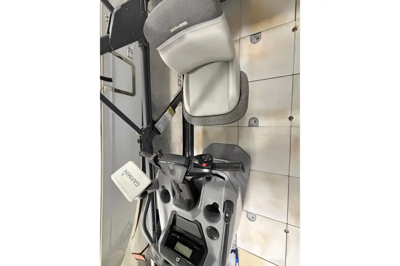 Slide: The Image of 2022 Sea-Doo Switch Cruise 21 interior with Garmin navigation and comfortable seating. - 15