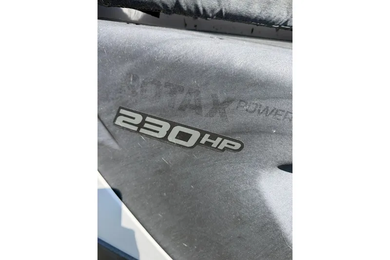 Slide: The Image of Close-up of 2022 Sea-Doo Switch Cruise 21, showcasing 230 HP Rotax engine detail. - 17