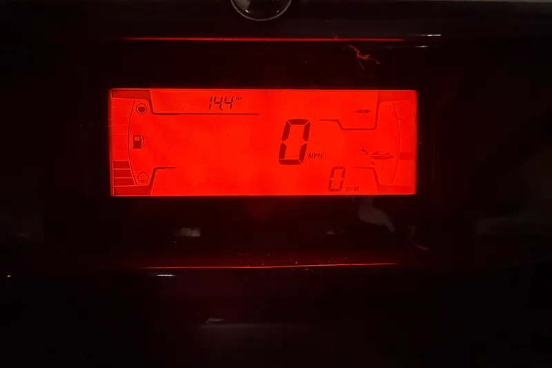 Slide: The Image of Dashboard display of 2022 Sea-Doo Switch Cruise 21 showing 144 hours and 0 MPH. - 6