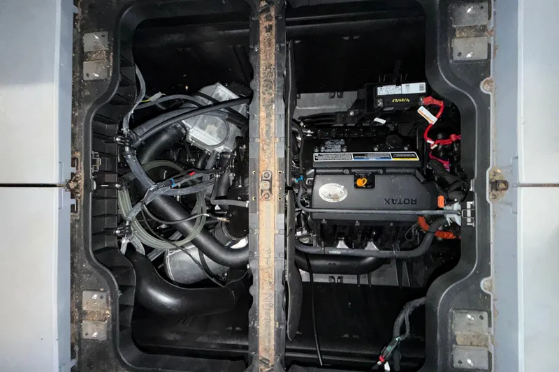 Slide: The Image of Engine compartment of a 2022 Sea-Doo Switch Cruise 21, showcasing Rotax engine components. - 9