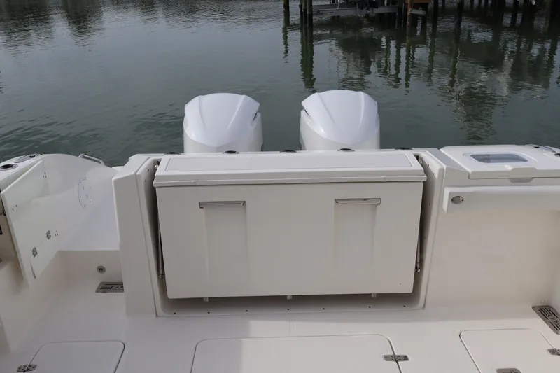 Slide: The Image of 2021 Pursuit S 328 Sport boat with dual engines and rear deck view. - 33