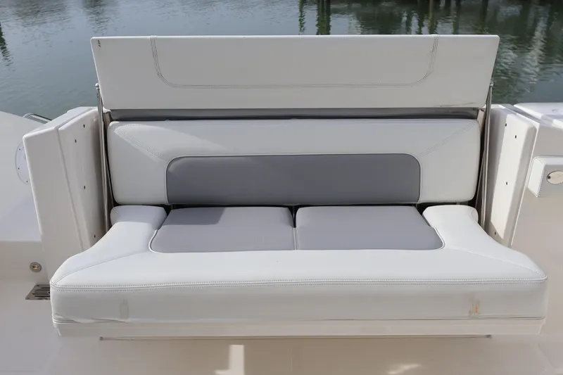 Slide: The Image of 2021 Pursuit S 328 Sport boat seat with white and gray upholstery. - 35