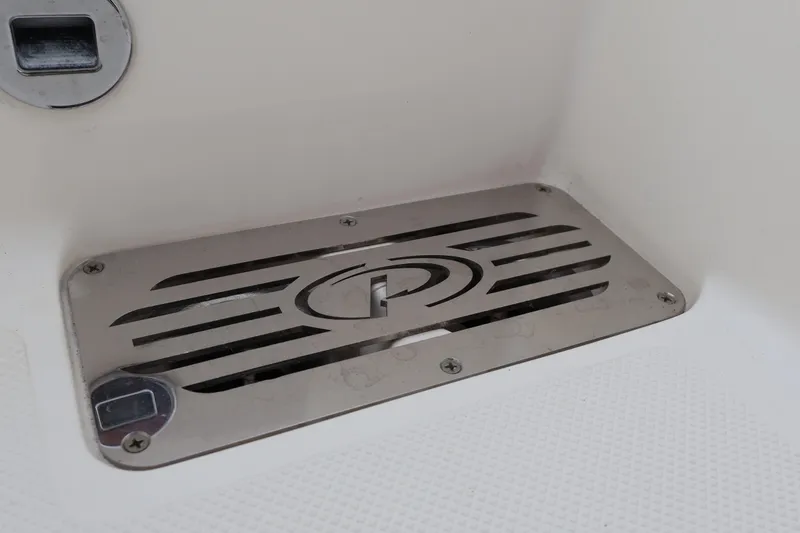 Slide: The Image of Stainless steel drain cover on 2021 Pursuit S 328 Sport boat. - 42