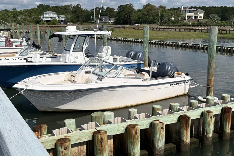 The Image of 2008 Grady-White Tournament 205 boat docked at marina, sunny day. - 0