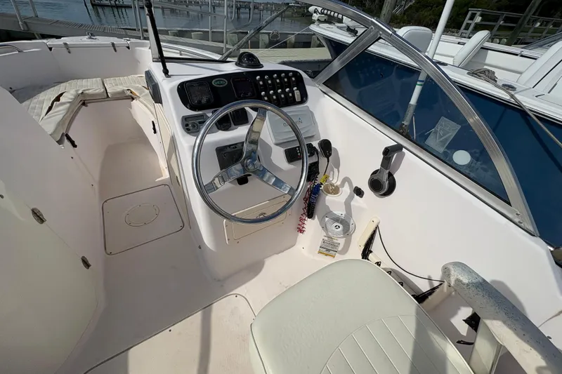 Slide: The Image of 2008 Grady-White Tournament 205 boat cockpit with steering wheel and control panel. - 10