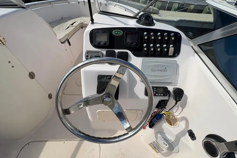 Slide: The Image of Steering console of a 2008 Grady-White Tournament 205 boat with Garmin navigation system. - 11