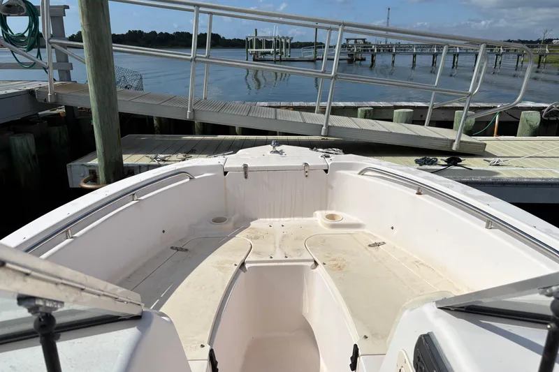 Slide: The Image of 2008 Grady-White Tournament 205 boat docked at marina, bow seating area visible. - 5