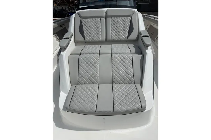 Slide: The Image of Luxurious seating on 2023 Pursuit S 428 Sport boat with quilted gray upholstery. - 11