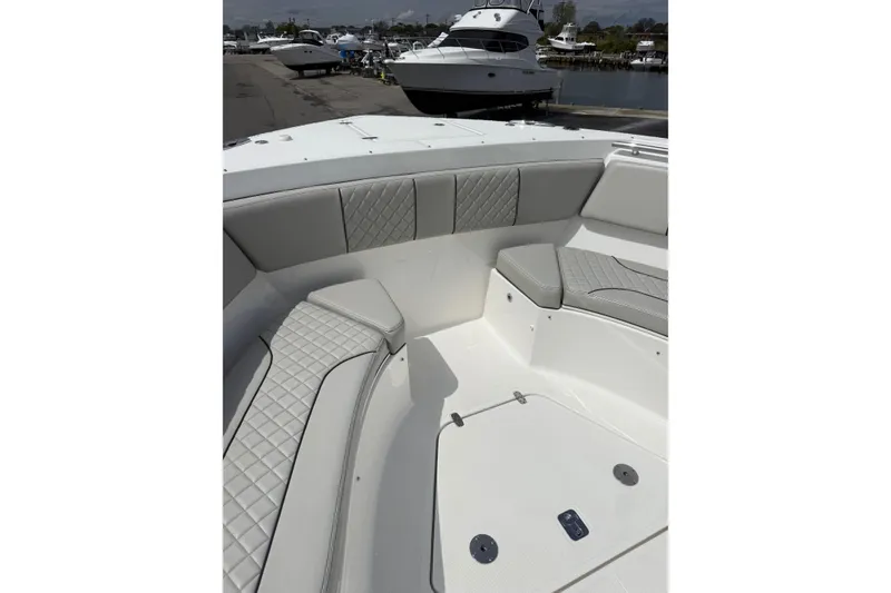 Slide: The Image of 2023 Pursuit S 428 Sport boat interior with luxurious seating and elegant design. - 13