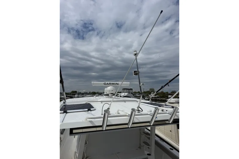 Slide: The Image of 2023 Pursuit S 428 Sport boat with Garmin radar under cloudy sky. - 17