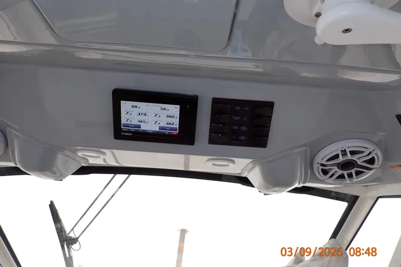 Slide: The Image of 2023 Pursuit S 428 Sport boat dashboard with Yamaha display and speaker system. - 23