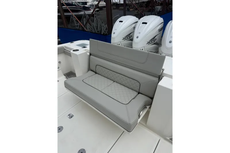 Slide: The Image of 2023 Pursuit S 428 Sport boat with cushioned seating and Yamaha engines. - 3