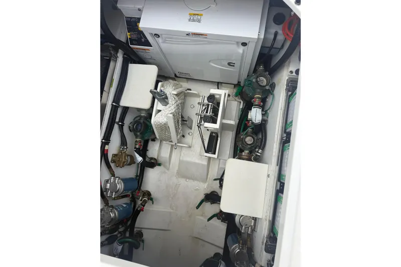 Slide: The Image of Engine compartment of 2023 Pursuit S 428 Sport boat, showcasing mechanical components. - 5