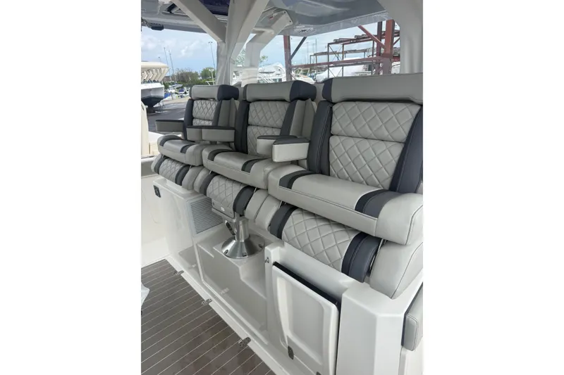 Slide: The Image of Luxurious seating on the 2023 Pursuit S 428 Sport boat, featuring quilted upholstery. - 7